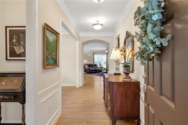 2920 Farmstead Way, Suwanee, GA 30024 - entrance foyer featuring light wood-style flooring, arched walkways, and crown molding
