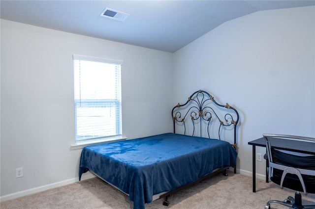 bedroom featuring carpet floors, lofted ceiling, visible vents, and baseboards