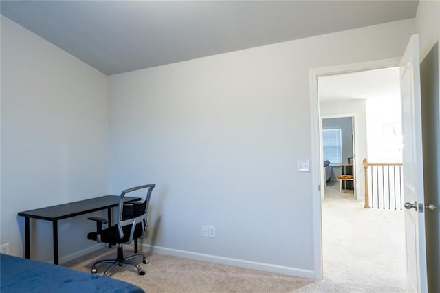 carpeted bedroom featuring baseboards