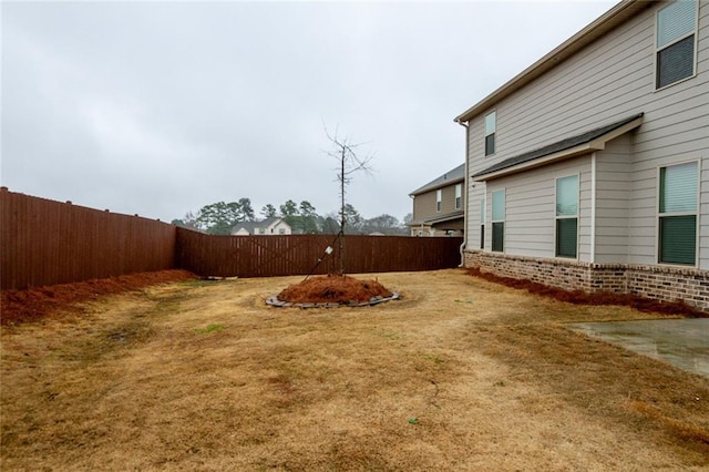 view of yard with a fenced backyard