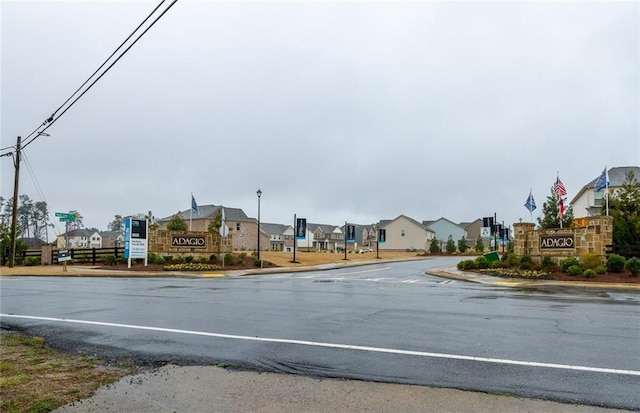 view of street featuring curbs and a residential view