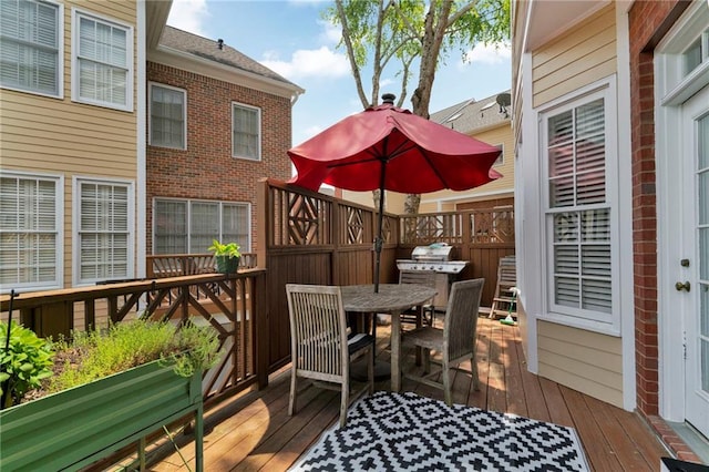 deck with outdoor dining space