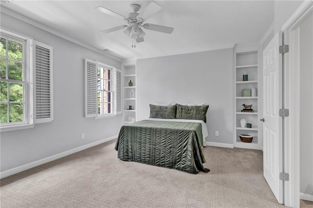 bedroom featuring carpet, ornamental molding, baseboards, and ceiling fan