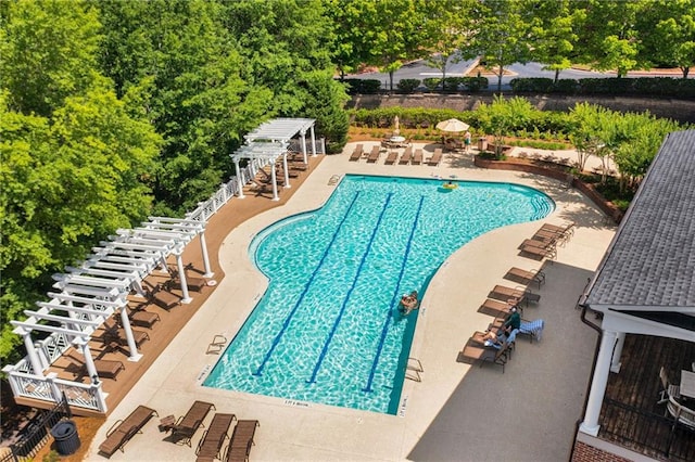 community pool featuring a pergola, a patio area, and stairs