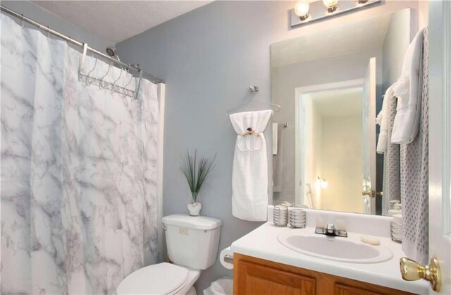 4014 Ivy Trace Ln, Ellenwood, GA 30294 - bathroom with curtained shower, toilet, and vanity