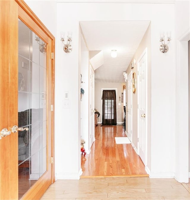 4014 Ivy Trace Ln, Ellenwood, GA 30294 - hallway featuring baseboards and light wood-style floors