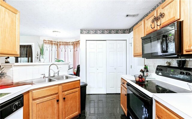 4014 Ivy Trace Ln, Ellenwood, GA 30294 - kitchen featuring light countertops, a sink, black microwave, dishwashing machine, and electric range
