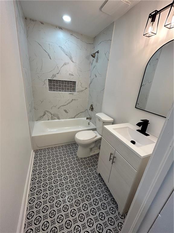 bathroom featuring tub / shower combination, toilet, recessed lighting, and vanity