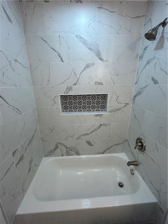 bathroom with shower / bathtub combination