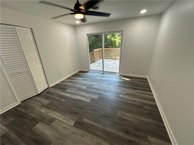 unfurnished bedroom with visible vents, dark wood finished floors, recessed lighting, baseboards, and access to exterior