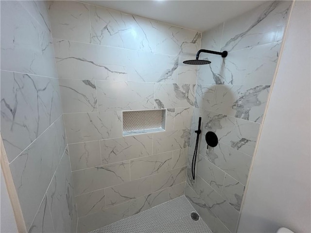 full bathroom with a tile shower