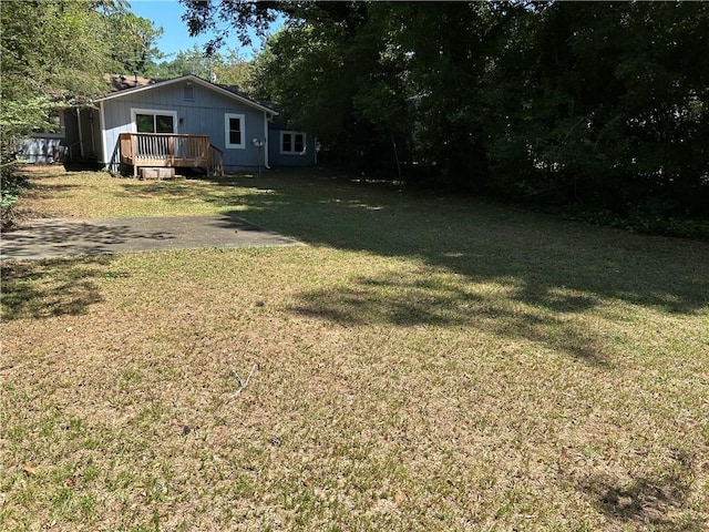 view of yard featuring a wooden deck