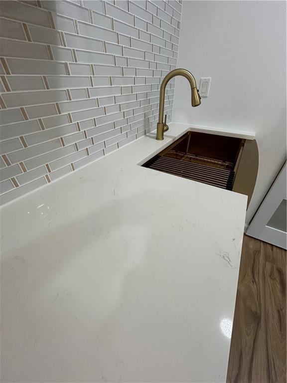 details featuring light countertops and a sink