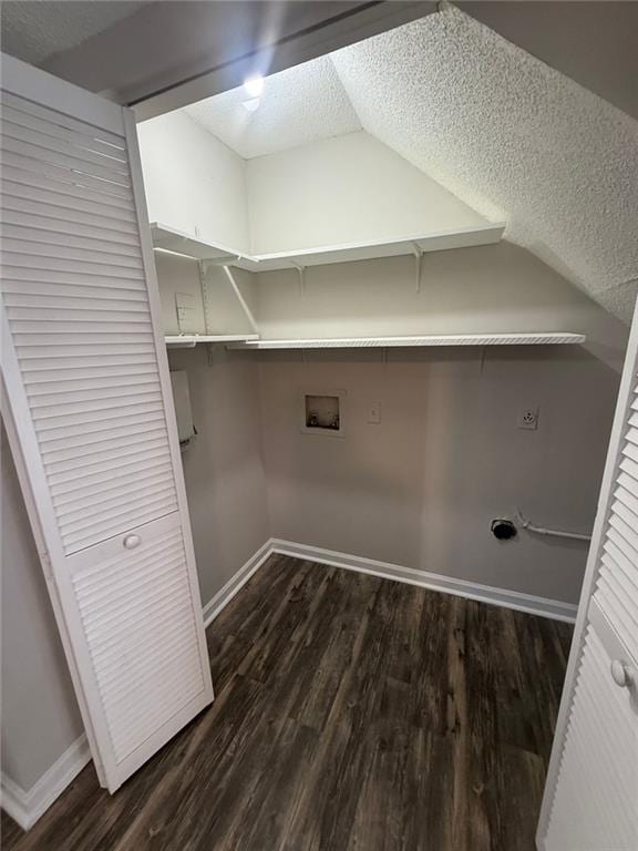 laundry area featuring washer hookup, dark hardwood / wood-style floors, hookup for an electric dryer, and a textured ceiling