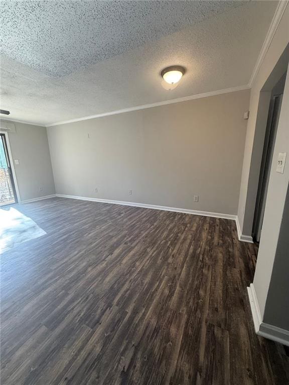 empty room with crown molding, dark wood-type flooring, and a textured ceiling