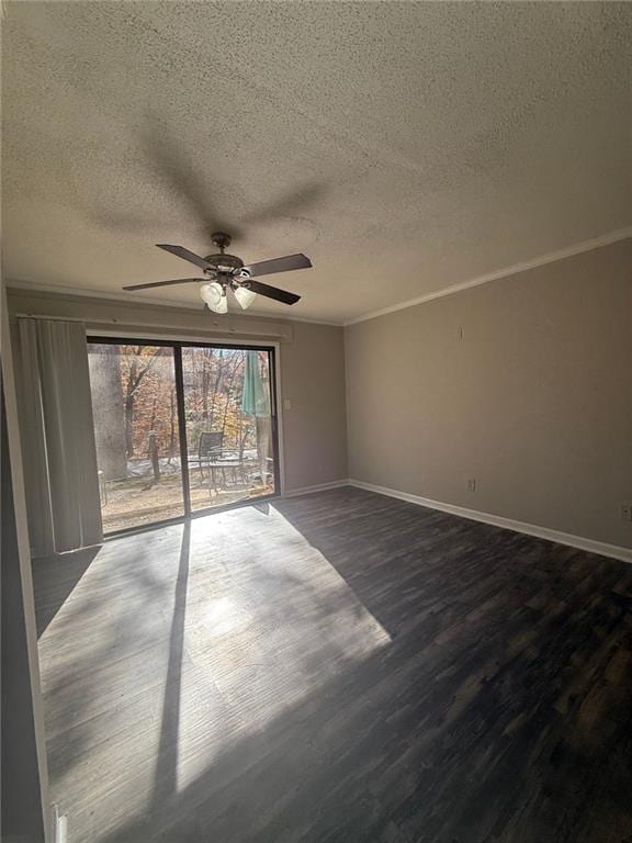 spare room with crown molding, ceiling fan, wood-type flooring, and a textured ceiling