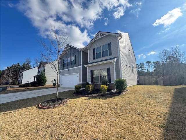 view of front of home featuring a front lawn and a garage