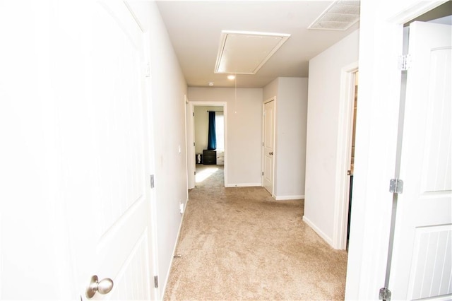 corridor with light colored carpet