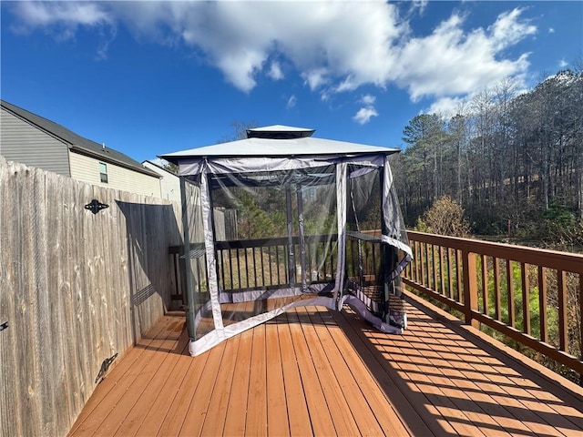 wooden deck featuring a gazebo