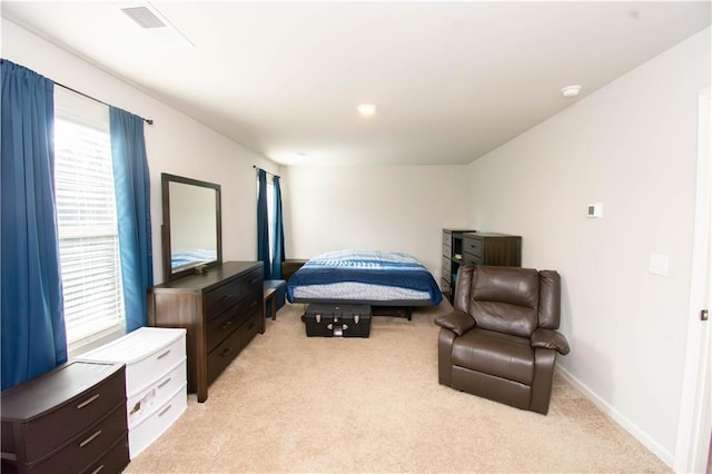 bedroom featuring light carpet