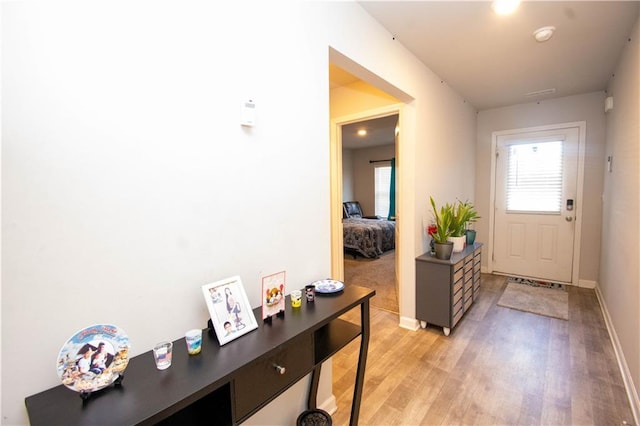 doorway with light hardwood / wood-style flooring