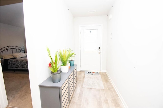 hallway featuring light hardwood / wood-style floors