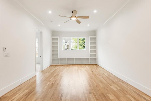 spare room with ceiling fan, light hardwood / wood-style floors, and ornamental molding