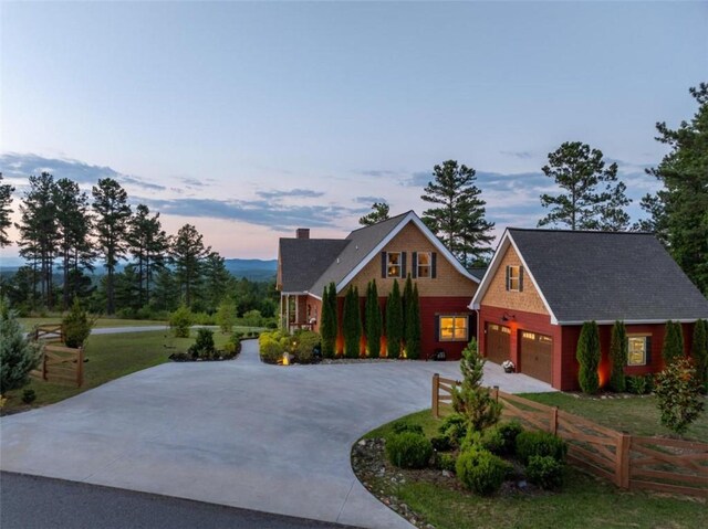 view of front facade featuring a yard and a garage