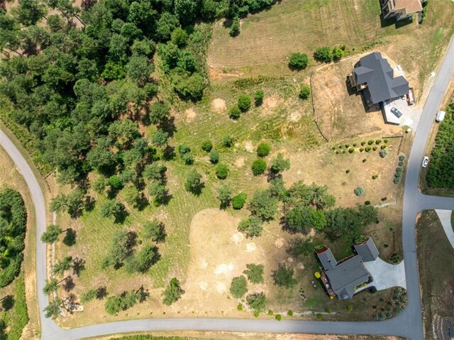 birds eye view of property with a rural view