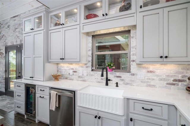 kitchen featuring white cabinetry, dark wood-type flooring, wine cooler, dishwasher, and sink