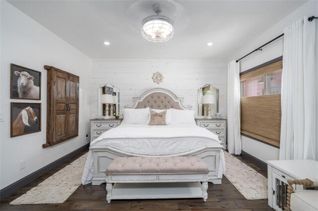 bedroom with dark hardwood / wood-style flooring