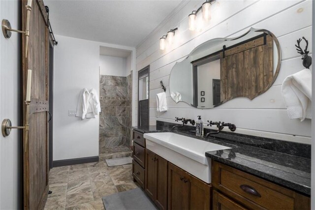 bathroom with walk in shower and vanity