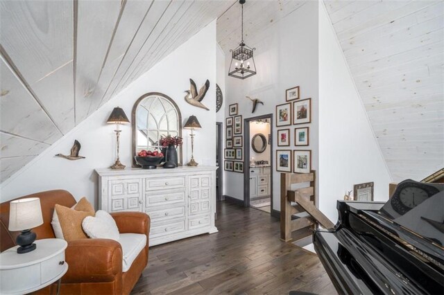 living area featuring wood ceiling, lofted ceiling, and dark wood-type flooring