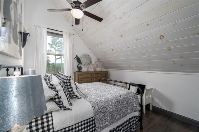 bedroom featuring lofted ceiling, dark wood-type flooring, and ceiling fan