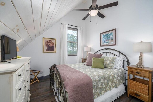 bedroom featuring wooden ceiling, vaulted ceiling, dark hardwood / wood-style floors, and ceiling fan