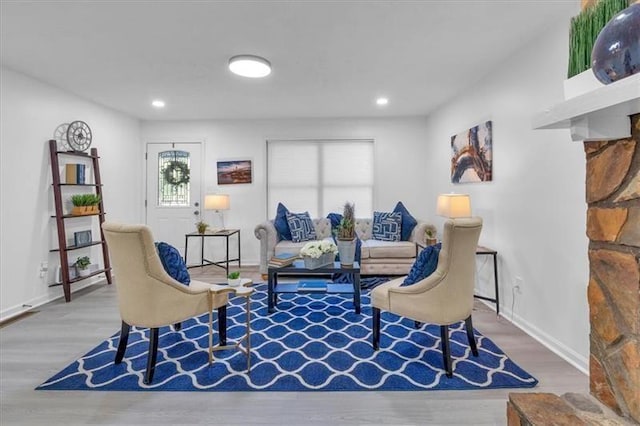 sitting room featuring recessed lighting, baseboards, and wood finished floors