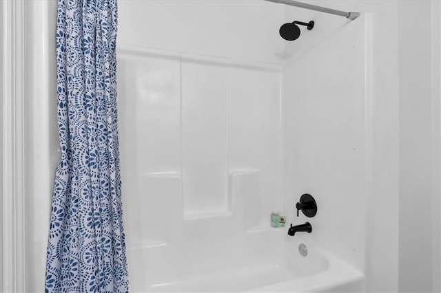 full bathroom with shower / bath combo