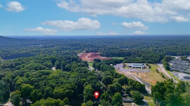 drone / aerial view featuring a forest view