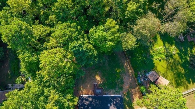 drone / aerial view featuring a view of trees