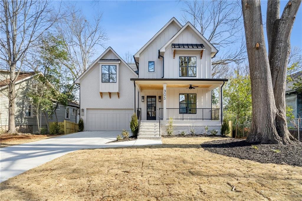 modern farmhouse with a garage and covered porch