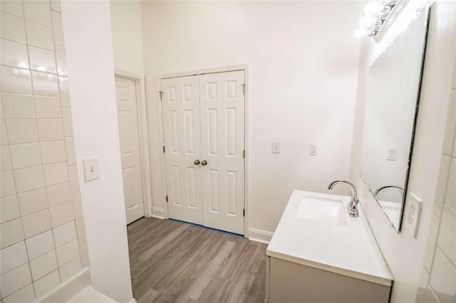 bathroom featuring vanity and wood finished floors