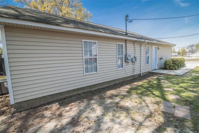 view of side of home featuring a lawn