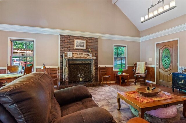 living room featuring a fireplace and lofted ceiling with beams