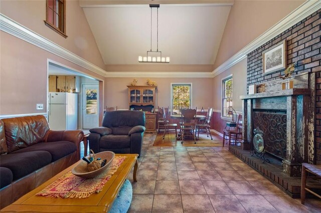 tiled living room featuring high vaulted ceiling and a fireplace