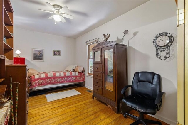 bedroom featuring ceiling fan and hardwood / wood-style flooring