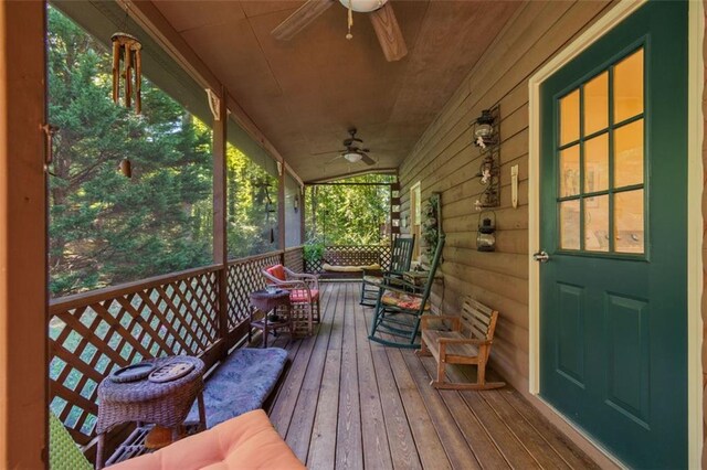 deck with a porch and ceiling fan