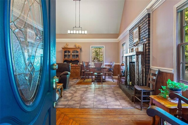 office space featuring a fireplace, vaulted ceiling, and a healthy amount of sunlight