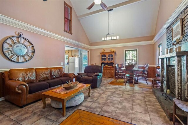 living room featuring ceiling fan, tile patterned flooring, and high vaulted ceiling