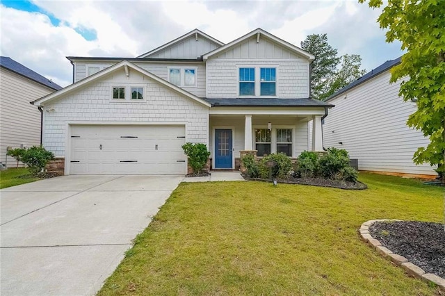 craftsman-style house with a garage and a front lawn