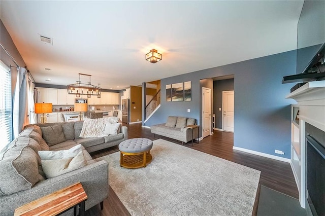 living room featuring dark hardwood / wood-style floors